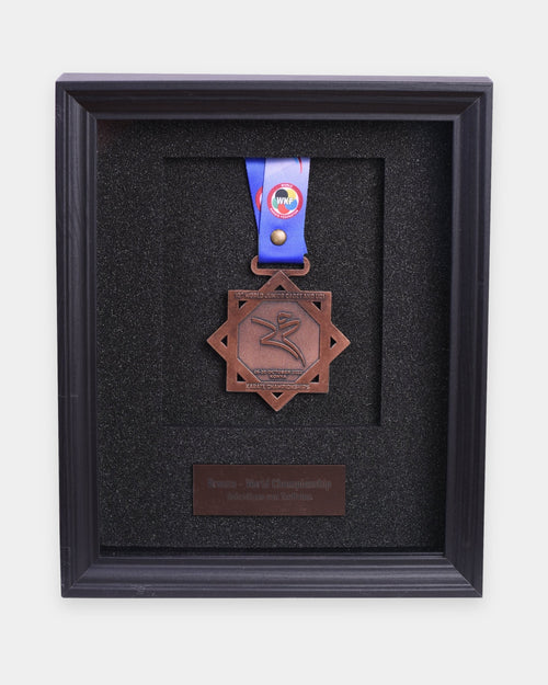 Single medal frame with a bronze medal and an engraved nameplate