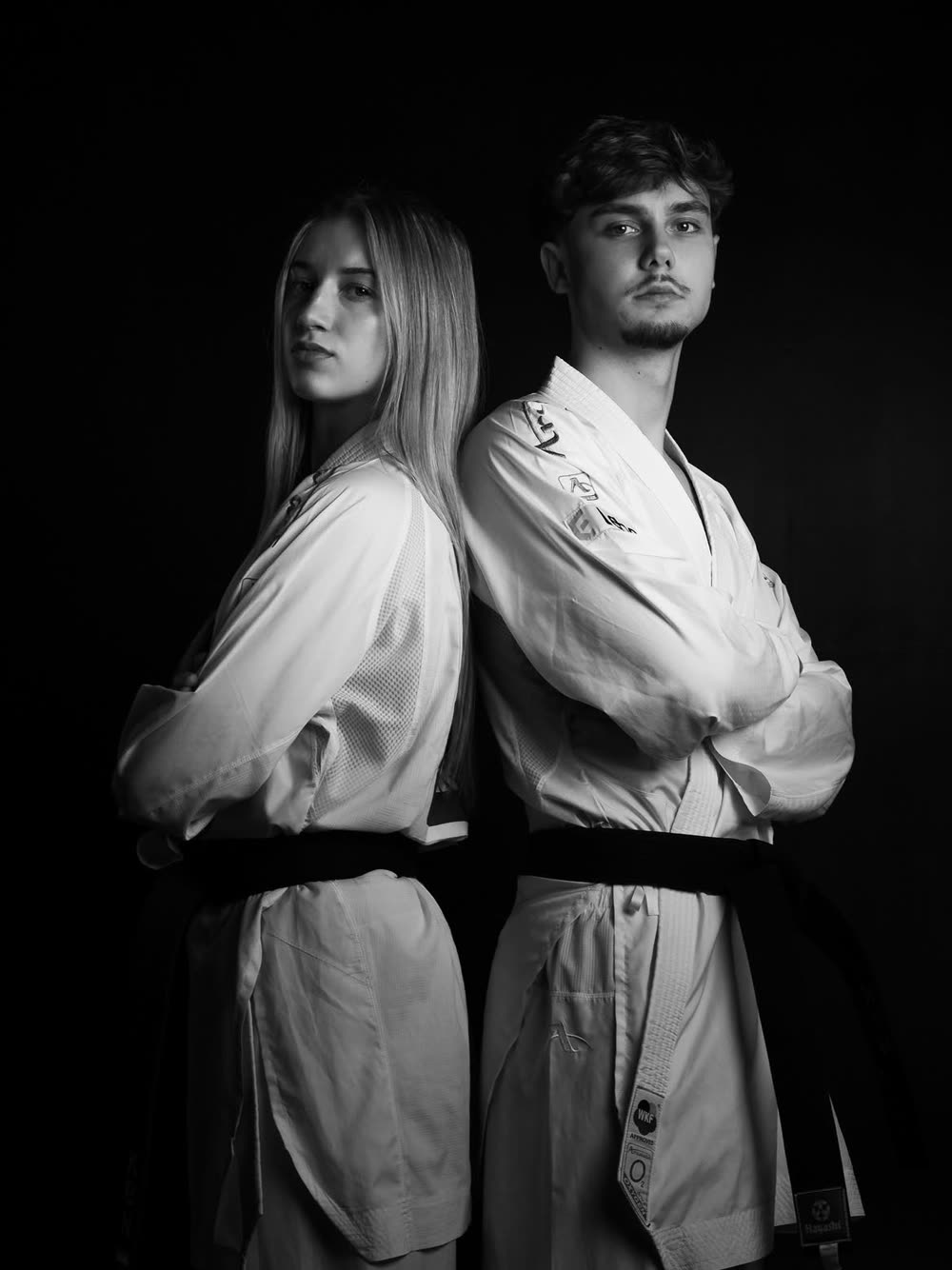 Ashley Kakiay and Sebastiaan van Teeffelen back to back in their karate gi